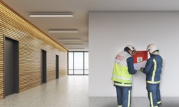 Modern office hallway with certified fire doors, enhancing fire safety for the workplace.